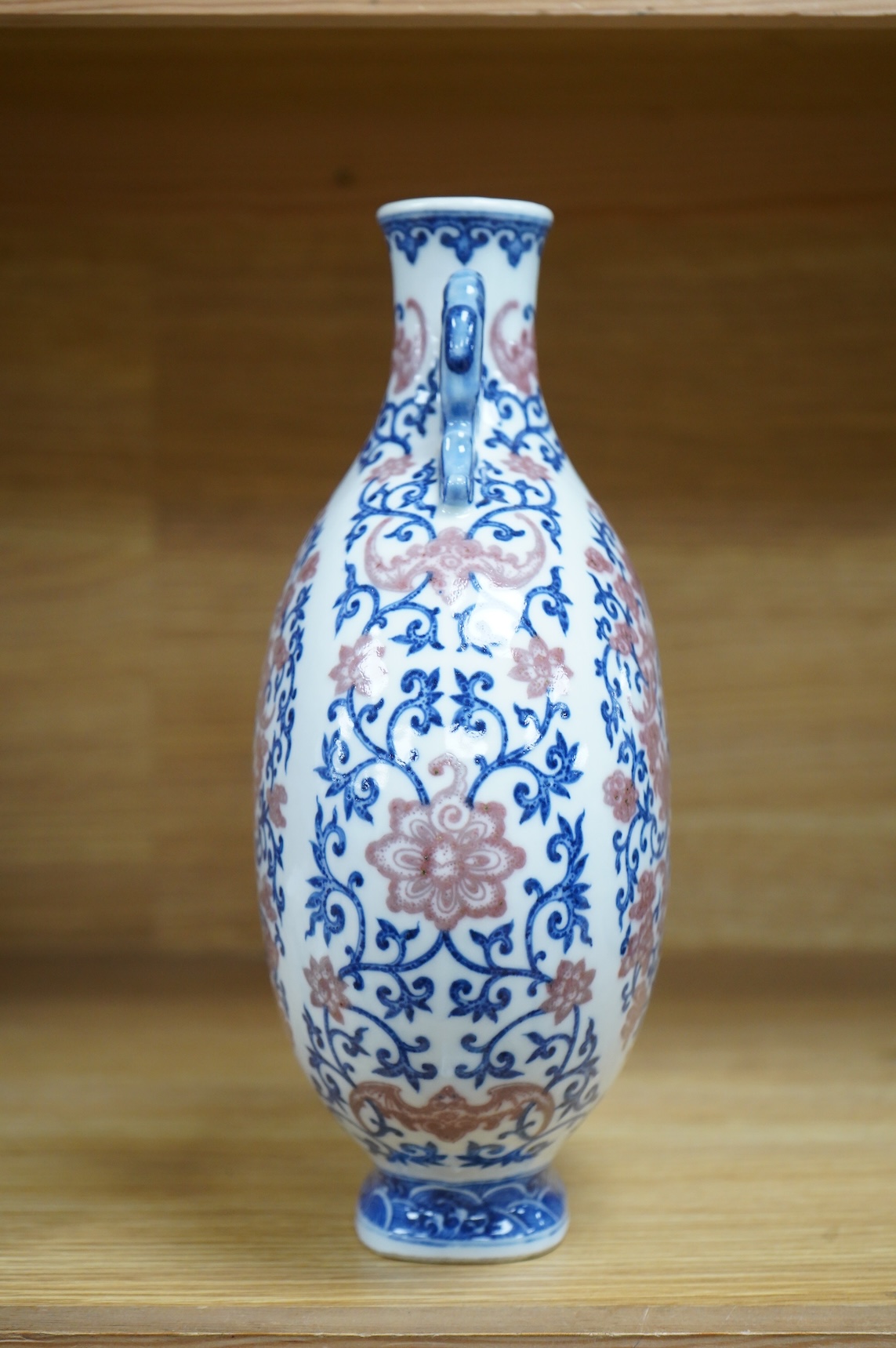 A 20th century Chinese underglaze blue and copper red moonflask, seal mark to base, 26.5cm